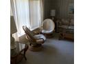 Bright living room with natural light and bamboo furniture at 6515 Raintree Ne Ln, Winter Haven, FL 33881