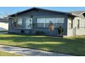 Charming single-story home featuring a well-manicured lawn and dark brick exterior at 707 Great Barford St, Auburndale, FL 33823