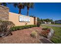 Sandpiper Golf & Country Club community entrance sign with lush landscaping and brick accents at 1055 Canary S Cir, Lakeland, FL 33809