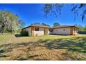 Charming single story home with stone accents, shuttered windows, and a well maintained yard at 122 Wgto Tower Rd, Lake Alfred, FL 33850