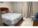 Cozy bedroom featuring a comfortable bed, stylish linens, and soft natural lighting at 1393 Axel Cir, Winter Haven, FL 33880