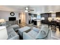 Cozy living room and kitchen with stainless appliances and an island at 167 Bonnie Dr, Auburndale, FL 33823