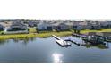 Aerial view of waterfront properties, showing backyard docks and a tranquil lake setting, ideal for waterside living at 169 Summershore Dr, Auburndale, FL 33823