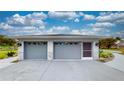 Two-car garage with updated doors, providing convenient and secure parking with attractive stone accents at 217 Kent Ct, Haines City, FL 33844