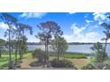 Scenic view of the lake and surrounding greenery from the property at 2750 W Lake Hamilton Dr, Winter Haven, FL 33881