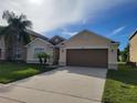 Lovely single-story house with a well-manicured lawn and mature landscaping at 4610 Yellow Bay Dr, Kissimmee, FL 34758