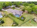 Sprawling backyard with pool, spa, and manicured landscaping offering a private outdoor oasis at 5020 Broadmore Dr, Auburndale, FL 33823