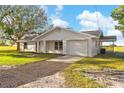 Well-maintained one-story home featuring a covered parking area and a spacious lawn at 6430 Russo Rd, Bartow, FL 33830