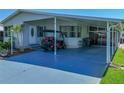 Well-maintained single-story home featuring covered carport and adjacent enclosed lanai at 6603 Scenic Point Se Dr, Winter Haven, FL 33884