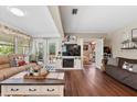 Warm and welcoming living room boasts wood flooring, fireplace, and French doors leading to the outdoors at 903 S Lakeview Ave, Bartow, FL 33830