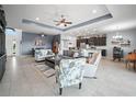 Bright and airy living room featuring tile floors, an open layout, and stylish furnishings at 1057 Sawgrass Dr, Winter Haven, FL 33884