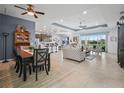 Spacious open-plan living room with tile flooring and a seamless flow to the modern kitchen at 1057 Sawgrass Dr, Winter Haven, FL 33884