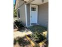 Inviting front entry with flower boxes at 180 Old Connersville Rd, Bartow, FL 33830