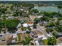 Aerial view of the property's location within a residential neighborhood and in close proximity to a lake at 2301 Freemason St, Lakeland, FL 33801