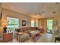 Cozy living room with a comfortable sofa, tile floors, and natural light at 2654 Rutledge Ct, Winter Haven, FL 33884
