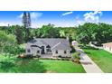 Well-maintained home with lush landscaping, long driveway and additional detached garage at 508 Starr Ridge Dr, Lake Wales, FL 33898