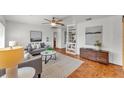 Bright and inviting living room with hardwood floors, stylish furniture, and built-in shelving at 1032 Tower Blvd, Lake Wales, FL 33853