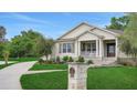 Beautiful home exterior showcasing a manicured lawn, a mailbox, and a paved walkway at 1162 E Highland Dr, Lakeland, FL 33813