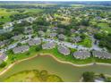 Extensive condo community with lake, verdant landscaping, and multiple buildings, promising serene living at 1503 Eagle Pond Dr # 1503, Winter Haven, FL 33884