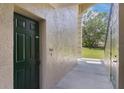 Close-up of front door and entryway with textured walls at 1602 Eagle Pond Dr # 1602, Winter Haven, FL 33884