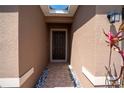 Inviting front entry with tiled walkway and decorative landscaping at 249 Haines Blvd, Winter Haven, FL 33881