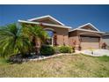 Charming one-story home boasts a well-manicured lawn and colorful landscaping at 249 Haines Blvd, Winter Haven, FL 33881