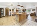 Open concept living area with center island, featuring a dining area and cozy living space at 2726 Prine Rd, Lakeland, FL 33810