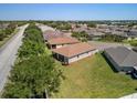 Aerial view of a community with houses and mature trees and landscaping at 3565 Raleigh Dr, Winter Haven, FL 33884