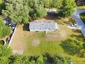 This cozy home has a spacious yard with lush greenery and a private setting at 3611 Island Oaks Ct, Lakeland, FL 33805
