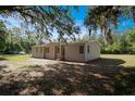 Charming single-story home nestled among mature trees, offering a peaceful and private setting at 3611 Island Oaks Ct, Lakeland, FL 33805