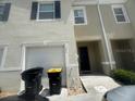 A well-kept townhome featuring an attached garage and front entry at 386 Feltrim Reserve Blvd # 386, Davenport, FL 33837