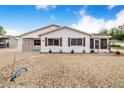 Well-maintained home with red shutters, a convenient carport, and beautiful white gravel landscaping at 4228 Nandina St, Lake Wales, FL 33898