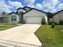 Beautiful single-story home featuring a two-car garage and a well-maintained lawn at 6316 Dolostone Dr, Lakeland, FL 33811