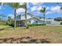 Beautiful two-story home featuring a covered porch, well maintained lawn, and an inviting pool at 6925 Alturas Babson Park Cutoff, Bartow, FL 33830