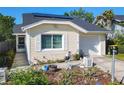 Lovely home boasting neat landscaping, a one car garage, and a welcoming entrance in a Gathering-friendly neighborhood at 711 Lake Dexter Cir, Winter Haven, FL 33884