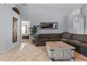 Inviting living room with tile flooring, offering ample space and a cozy seating arrangement at 8001 Arrow Creek Rd, Kissimmee, FL 34747