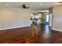 View of the open-concept living room featuring hardwood floors at 806 Avenue G Ne, Winter Haven, FL 33881