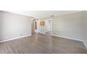 Spacious living room with modern flooring and neutral paint, offering a versatile living space at 109 Pasco Se Rd, Winter Haven, FL 33884