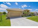 Lovely single-story house with a well-maintained lawn, an attached two-car garage, and an inviting front entrance at 132 Dinner Lake Ave, Lake Wales, FL 33859