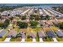 Aerial view of a residential area showcasing the property's location near a lake at 135 Eloise Oaks Dr, Winter Haven, FL 33884