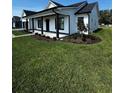 Front exterior of the home with a manicured lawn at 1787 Lakehill Dr, Winter Haven, FL 33884