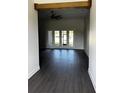 Spacious living room showcasing dark wood floors and sliding glass doors leading to outdoor space at 1787 Lakehill Dr, Winter Haven, FL 33884