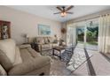 Inviting living room with sliding glass doors leading to outdoor space and filled with natural light at 225 Summershore Dr, Auburndale, FL 33823