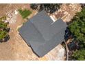 Aerial view of the dark gray roof of a well-maintained single-Gathering home with a driveway at 2390 Lake Easy Rd, Babson Park, FL 33827