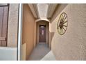 Charming entryway with a decorative sunburst wall hanging and a 'welcome' mat at 2577 Canyon Crest Dr, Lakeland, FL 33811