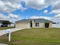 Single Gathering home with manicured lawn and an attached garage, and traditional architectural details at 351 Columbo St, Winter Haven, FL 33880
