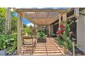Covered patio with brick flooring, decorative plants, and outdoor seating at 364 Lake Vista Dr, Auburndale, FL 33823