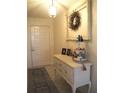 Inviting foyer with stylish decor and ample natural light at 4007 Cypress Lndg S, Winter Haven, FL 33884