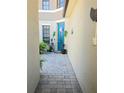 Inviting front entrance with a blue door, decorative plants, and a charming walkway at 4962 Sweet Cedar Cir, Orlando, FL 32829