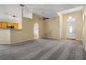 Spacious living room with neutral carpet, high ceilings, and an open layout at 533 Ronshelle Ave, Haines City, FL 33844